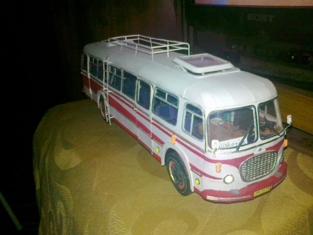 320077