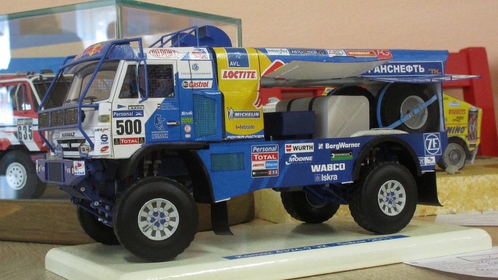327210